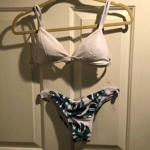 This is the cutest bathing suit with a basic white top and cute palm tree bottom